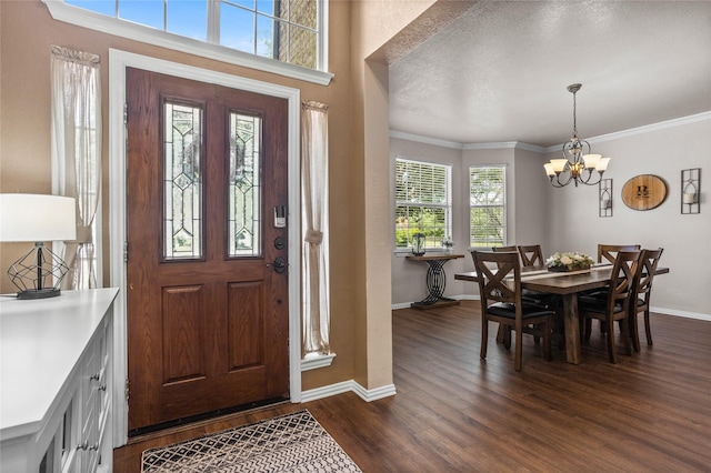 7705 Marble Canyon Ct, Fort Worth, TX 76137 - entryway featuring baseboards, dark wood-style flooring, a chandelier, and ornamental molding