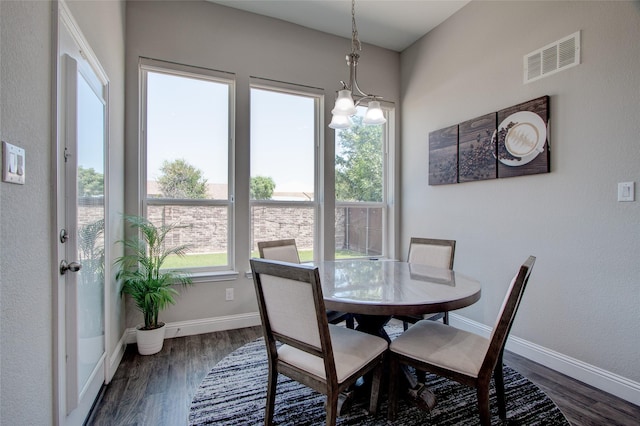 12990 Twelve Oaks Ave, Frisco, TX 75035 - dining room featuring dark wood-type flooring, baseboards, and a chandelier