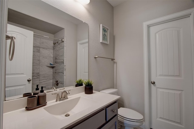 12990 Twelve Oaks Ave, Frisco, TX 75035 - bathroom with toilet, vanity, and a shower