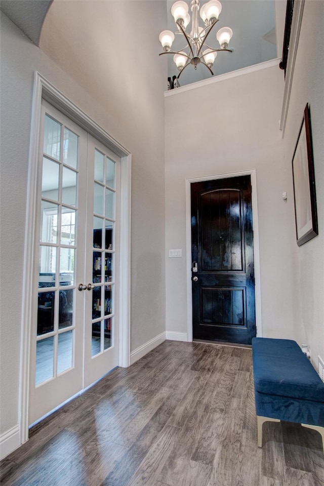 12990 Twelve Oaks Ave, Frisco, TX 75035 - foyer entrance featuring wood finished floors, a chandelier, french doors, and baseboards