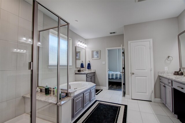 12990 Twelve Oaks Ave, Frisco, TX 75035 - ensuite bathroom featuring a stall shower, tile patterned floors, and vanity