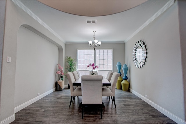 12990 Twelve Oaks Ave, Frisco, TX 75035 - dining area featuring a chandelier, dark wood-type flooring, baseboards, and crown molding