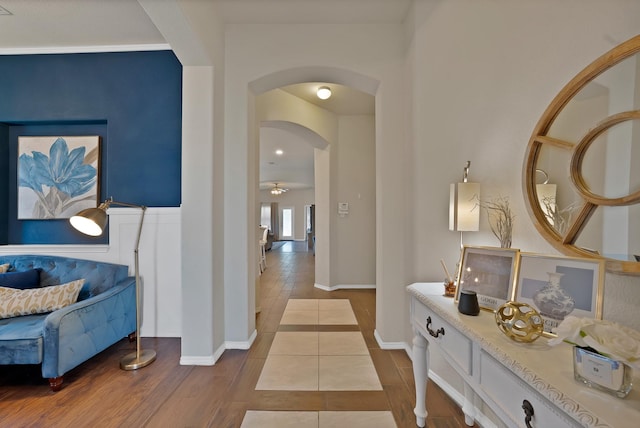 11913 Bellegrove Rd, Burleson, TX 76028 - corridor with arched walkways, baseboards, and tile patterned floors