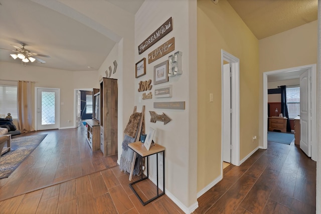 11913 Bellegrove Rd, Burleson, TX 76028 - hall with dark wood-style flooring, vaulted ceiling, and baseboards