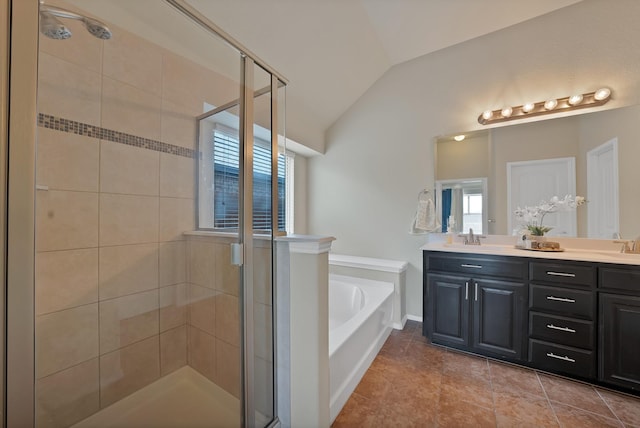 11913 Bellegrove Rd, Burleson, TX 76028 - bathroom featuring a shower stall, a garden tub, double vanity, vaulted ceiling, and plenty of natural light