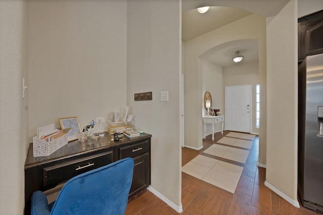 11913 Bellegrove Rd, Burleson, TX 76028 - hall with arched walkways, an office area, baseboards, and wood finished floors