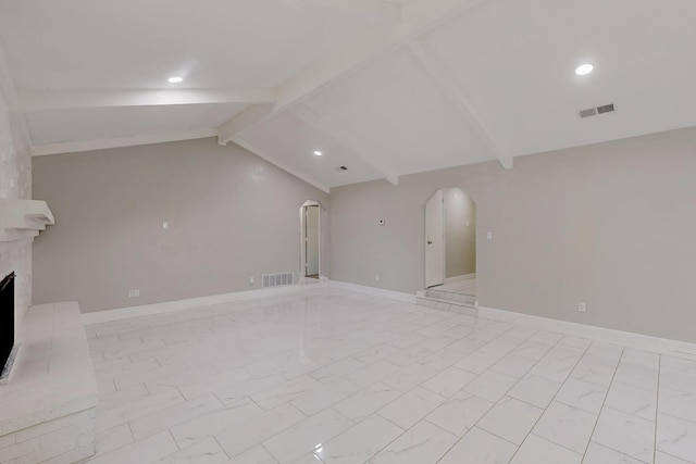 1723 Overbrook Dr, Arlington, TX 76014 - unfurnished living room with arched walkways, light marble finish flooring, recessed lighting, and a fireplace
