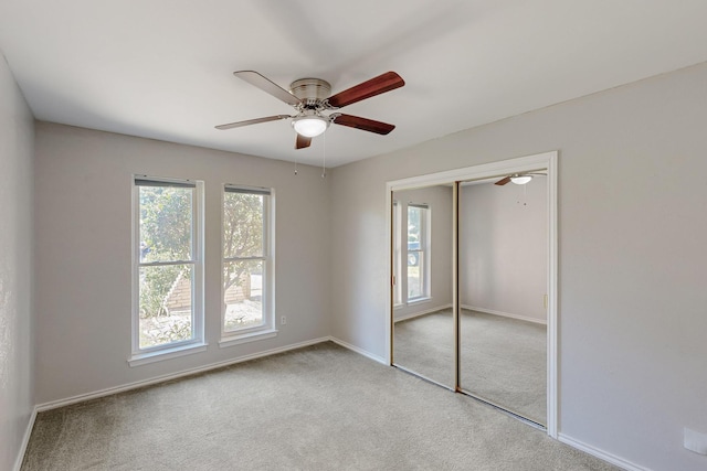 1723 Overbrook Dr, Arlington, TX 76014 - unfurnished bedroom featuring multiple windows, carpet flooring, baseboards, and a closet