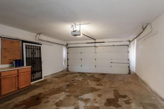 1723 Overbrook Dr, Arlington, TX 76014 - garage featuring a garage door opener and baseboards