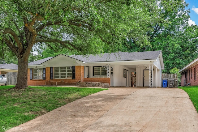2932 W Cavett Dr, Shreveport, LA 71104 - ranch-style house with concrete driveway, brick siding, a front yard, an attached carport, and a shingled roof