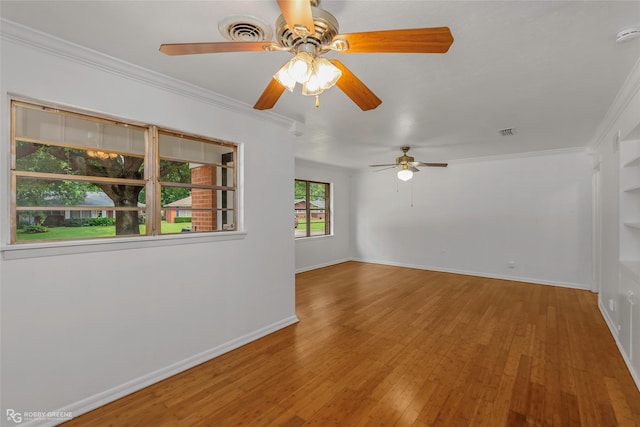 2932 W Cavett Dr, Shreveport, LA 71104 - unfurnished room with ceiling fan, ornamental molding, wood-type flooring, baseboards, and a smoke detector