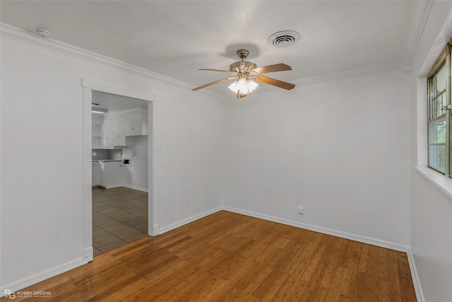 2932 W Cavett Dr, Shreveport, LA 71104 - spare room featuring a ceiling fan, wood finished floors, crown molding, and baseboards