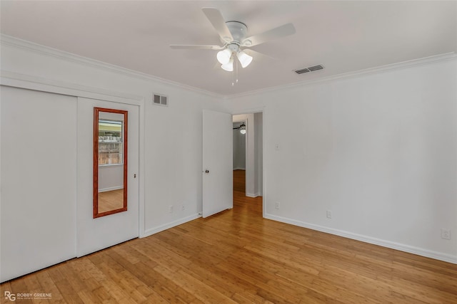 2932 W Cavett Dr, Shreveport, LA 71104 - spare room with ceiling fan, crown molding, light wood-style flooring, and baseboards