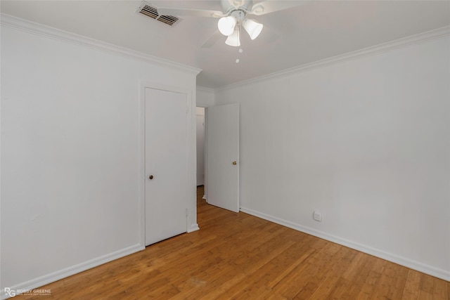 2932 W Cavett Dr, Shreveport, LA 71104 - spare room featuring light wood finished floors, ornamental molding, a ceiling fan, and baseboards