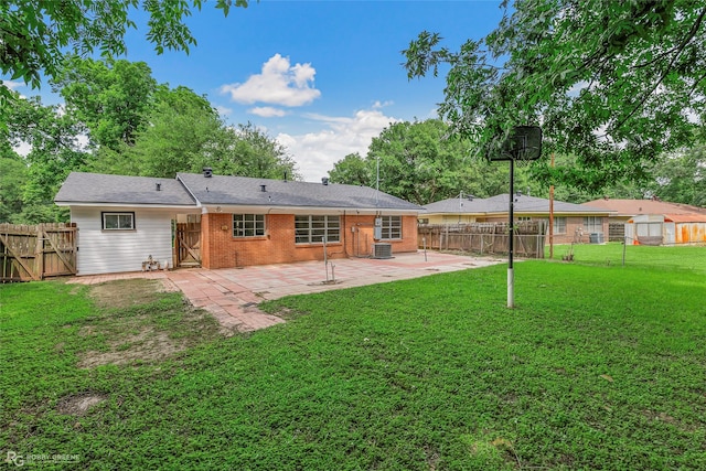 2932 W Cavett Dr, Shreveport, LA 71104 - back of property with a patio area, a gate, brick siding, and central air condition unit