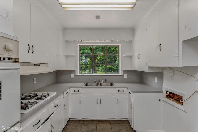 2932 W Cavett Dr, Shreveport, LA 71104 - kitchen with white appliances, open shelves, under cabinet range hood, a sink, and light countertops