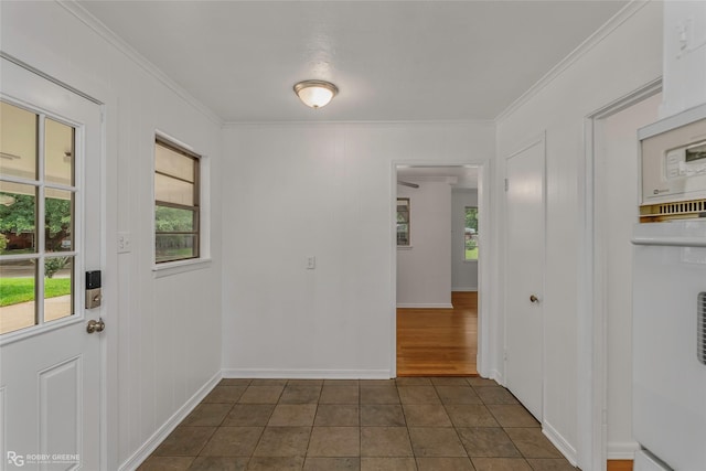 2932 W Cavett Dr, Shreveport, LA 71104 - empty room with crown molding, dark tile patterned flooring, and baseboards