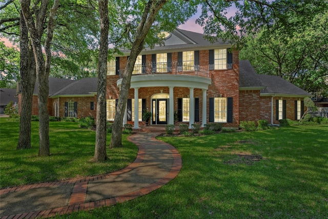 146 Shady Trl, Waco, TX 76657 - colonial inspired home featuring a balcony, a lawn, brick siding, and a porch