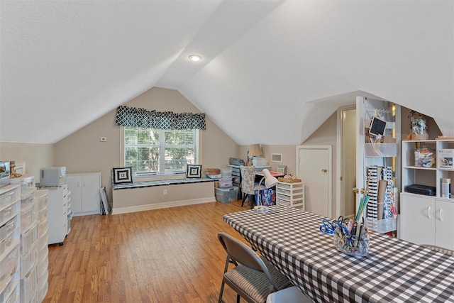 146 Shady Trl, Waco, TX 76657 - dining space with light wood-style flooring, lofted ceiling, and baseboards