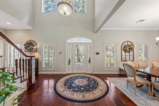 146 Shady Trl, Waco, TX 76657 - entryway with stairs, wood finished floors, baseboards, crown molding, and a towering ceiling
