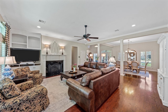 146 Shady Trl, Waco, TX 76657 - living room featuring decorative columns, a fireplace with flush hearth, a ceiling fan, dark wood-type flooring, and ornamental molding