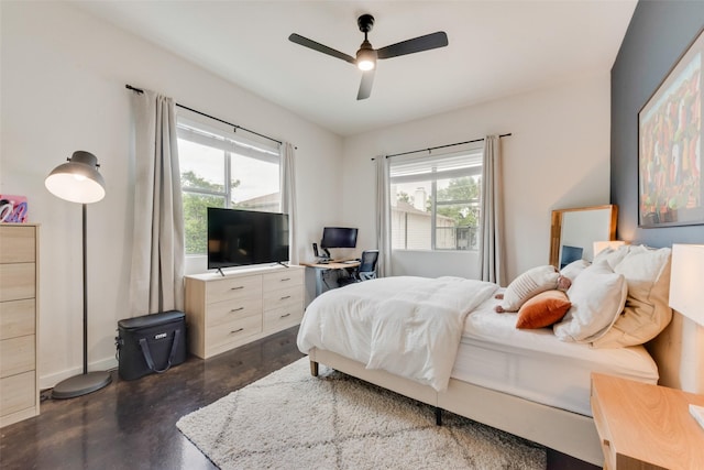 3025 Bryan St Unit 1F, Dallas, TX 75204 - bedroom featuring concrete floors, multiple windows, ceiling fan, and baseboards