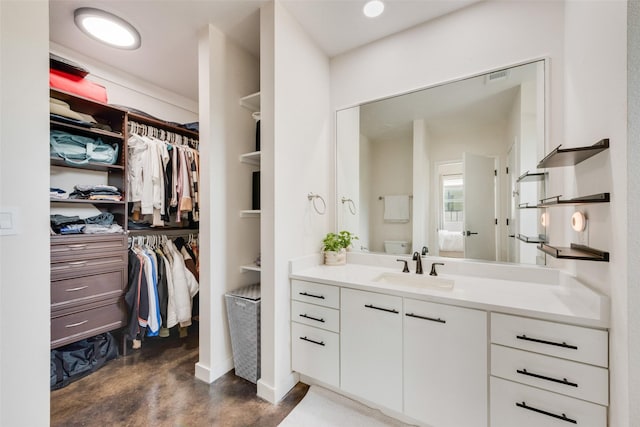 3025 Bryan St Unit 1F, Dallas, TX 75204 - full bathroom featuring vanity, a spacious closet, and concrete floors