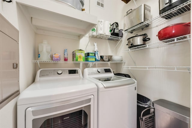 3025 Bryan St Unit 1F, Dallas, TX 75204 - washroom featuring washer and dryer