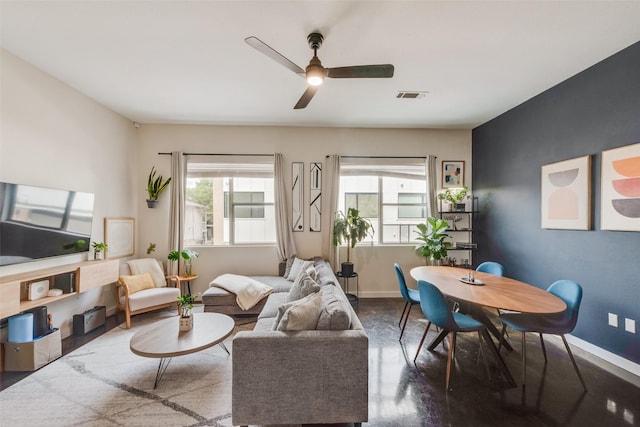 3025 Bryan St Unit 1F, Dallas, TX 75204 - living area with baseboards, a ceiling fan, and finished concrete floors