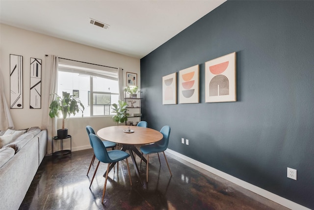 3025 Bryan St Unit 1F, Dallas, TX 75204 - dining area featuring concrete floors and baseboards