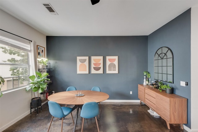 3025 Bryan St Unit 1F, Dallas, TX 75204 - dining room featuring baseboards and finished concrete flooring