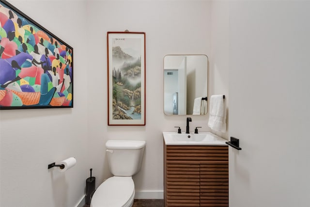 3025 Bryan St Unit 1F, Dallas, TX 75204 - bathroom with toilet, vanity, and baseboards