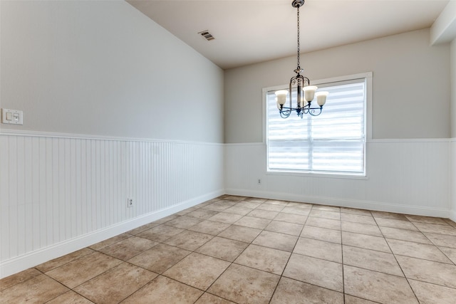 13274 Bayfield Dr, Frisco, TX 75033 - unfurnished room with wainscoting, a chandelier, and light tile patterned flooring