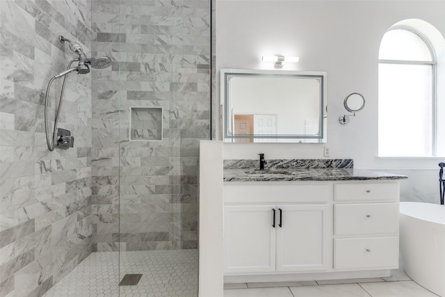 13274 Bayfield Dr, Frisco, TX 75033 - bathroom featuring a tile shower, vanity, a freestanding tub, and tile patterned flooring