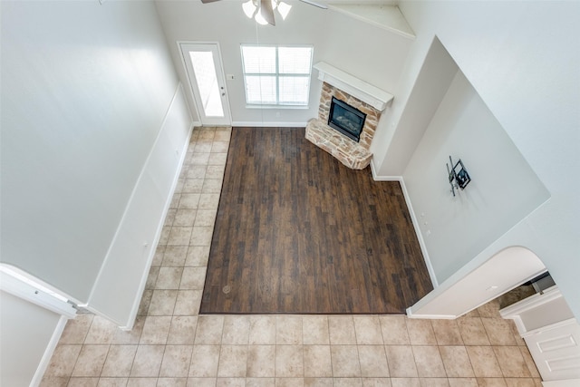 13274 Bayfield Dr, Frisco, TX 75033 - unfurnished living room featuring a ceiling fan, a fireplace, tile patterned flooring, and baseboards