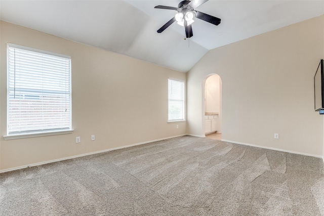 13274 Bayfield Dr, Frisco, TX 75033 - carpeted empty room featuring a ceiling fan, arched walkways, vaulted ceiling, and baseboards