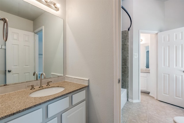 13274 Bayfield Dr, Frisco, TX 75033 - bathroom featuring vanity, tile patterned flooring, and washtub / shower combination