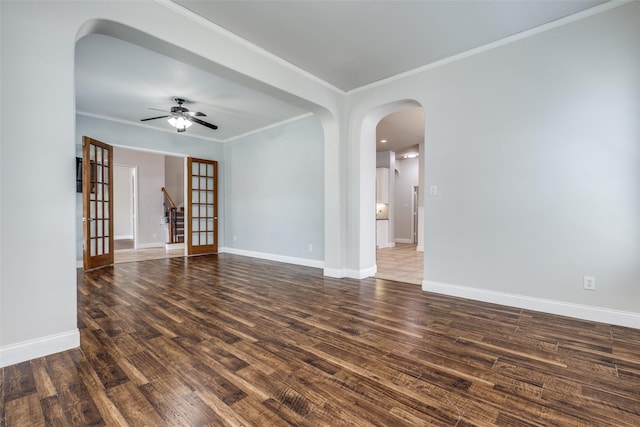 13274 Bayfield Dr, Frisco, TX 75033 - spare room with wood finished floors, crown molding, arched walkways, a ceiling fan, and baseboards