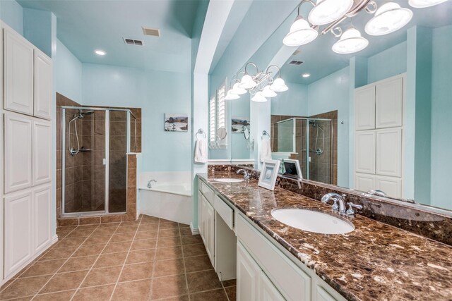 15630 Stonebridge Dr, Frisco, TX 75035 - bathroom featuring a stall shower, double vanity, a bath, and tile patterned floors