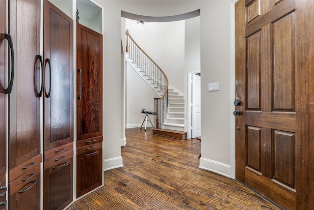 15630 Stonebridge Dr, Frisco, TX 75035 - entryway featuring baseboards, dark wood-style floors, and stairway