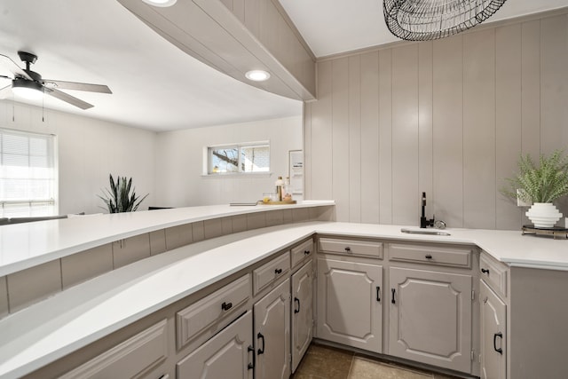 2005 Westshore Dr, Garland, TX 75043 - kitchen with a sink, ceiling fan, light countertops, and healthy amount of natural light