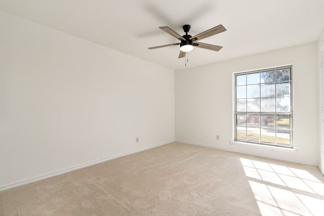 2005 Westshore Dr, Garland, TX 75043 - empty room featuring light colored carpet, a ceiling fan, and baseboards