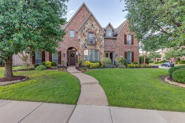2758 Sharlis Dr, Frisco, TX 75036 - view of front of home featuring brick siding, a front yard, and stone siding