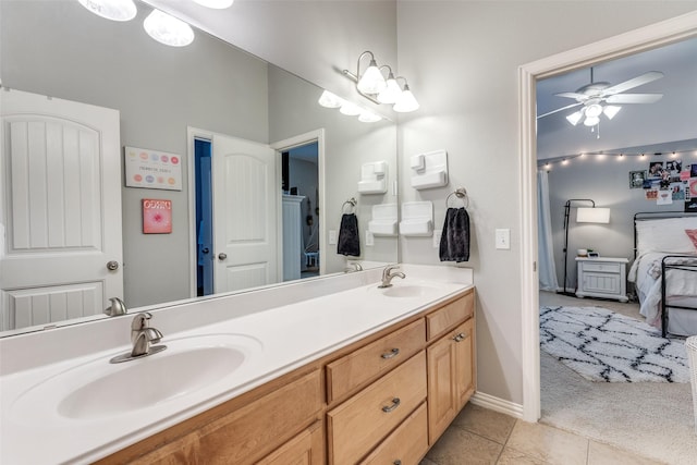2758 Sharlis Dr, Frisco, TX 75036 - bathroom featuring ensuite bath, double vanity, a ceiling fan, baseboards, and tile patterned floors