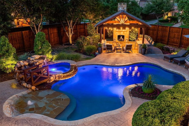 2758 Sharlis Dr, Frisco, TX 75036 - view of swimming pool with a patio area, a fenced backyard, an outdoor living space with a fireplace, and a pool with connected hot tub