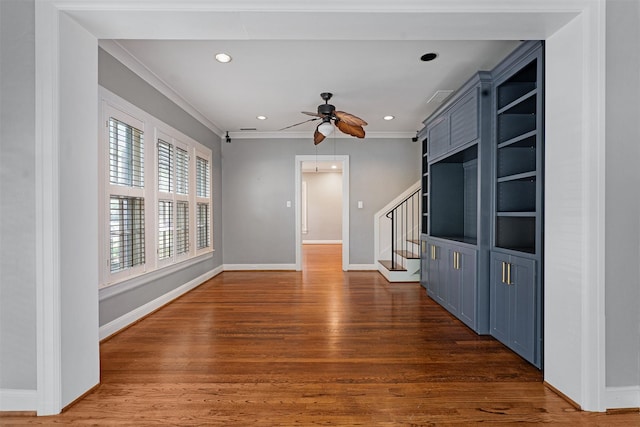 6843 Casa Loma Ave, Dallas, TX 75214 - unfurnished living room featuring crown molding, wood finished floors, ceiling fan, stairway, and baseboards