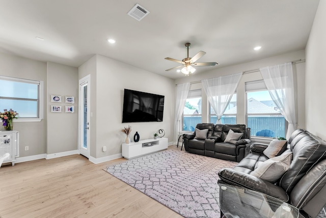 6313 Hedgecoxe Rd, The Colony, TX 75056 - living room featuring wood finished floors, ceiling fan, baseboards, and recessed lighting