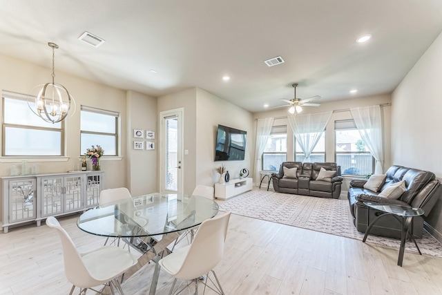 6313 Hedgecoxe Rd, The Colony, TX 75056 - dining space with light wood-style floors, a chandelier, ceiling fan, and recessed lighting