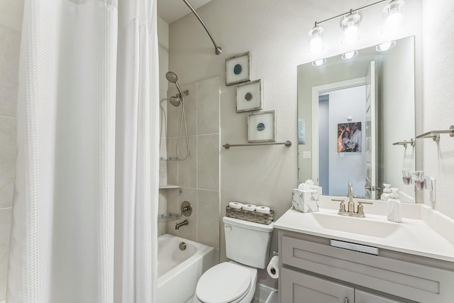6313 Hedgecoxe Rd, The Colony, TX 75056 - full bathroom featuring shower / bath combo with shower curtain, vanity, toilet, and a textured wall