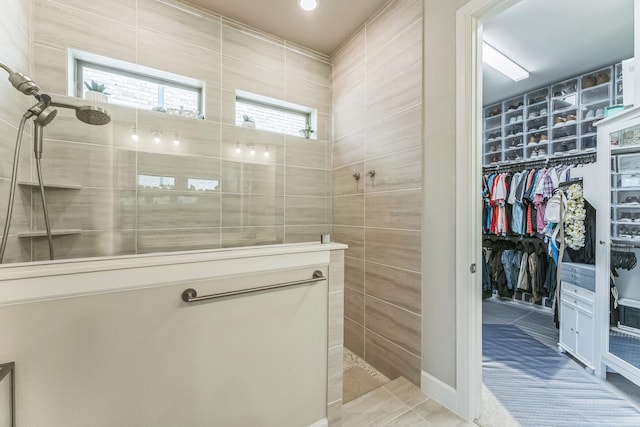 6313 Hedgecoxe Rd, The Colony, TX 75056 - bathroom featuring a walk in shower and a spacious closet